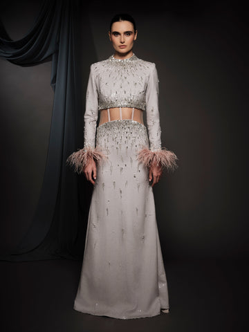 pale pink embroidered dress with feathers on the sleeves